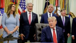 Arkansas Governor Sarah Huckabee Sanders, US Secretary of Health and Human Services (HHS) Robert F. Kennedy Jr. and Administrator for the Centers for Medicare and Medicaid Services Dr Mehmet Oz stand behind US President Donald J. Trump as he makes an announcement on healthcare in the Oval Office at the White House in Washington, D.C., US, September 18, 2026. REUTERS/Evan Vucci
