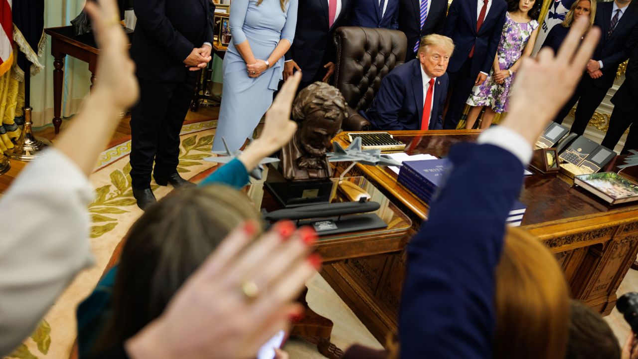 US President Donald Trump answers questions from reporters during an announcement in the Oval Office of the White House in Washington, DC, on September 18.